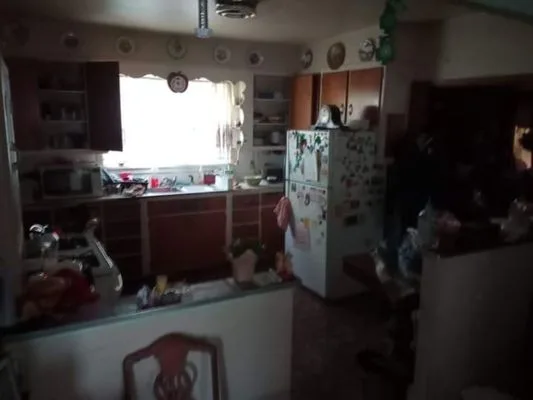Another kitchen before cleanout — full of items ready to be hauled out