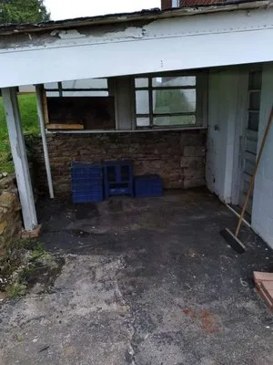 Shed or structure after demo and cleanout — cleared floor, walls removed